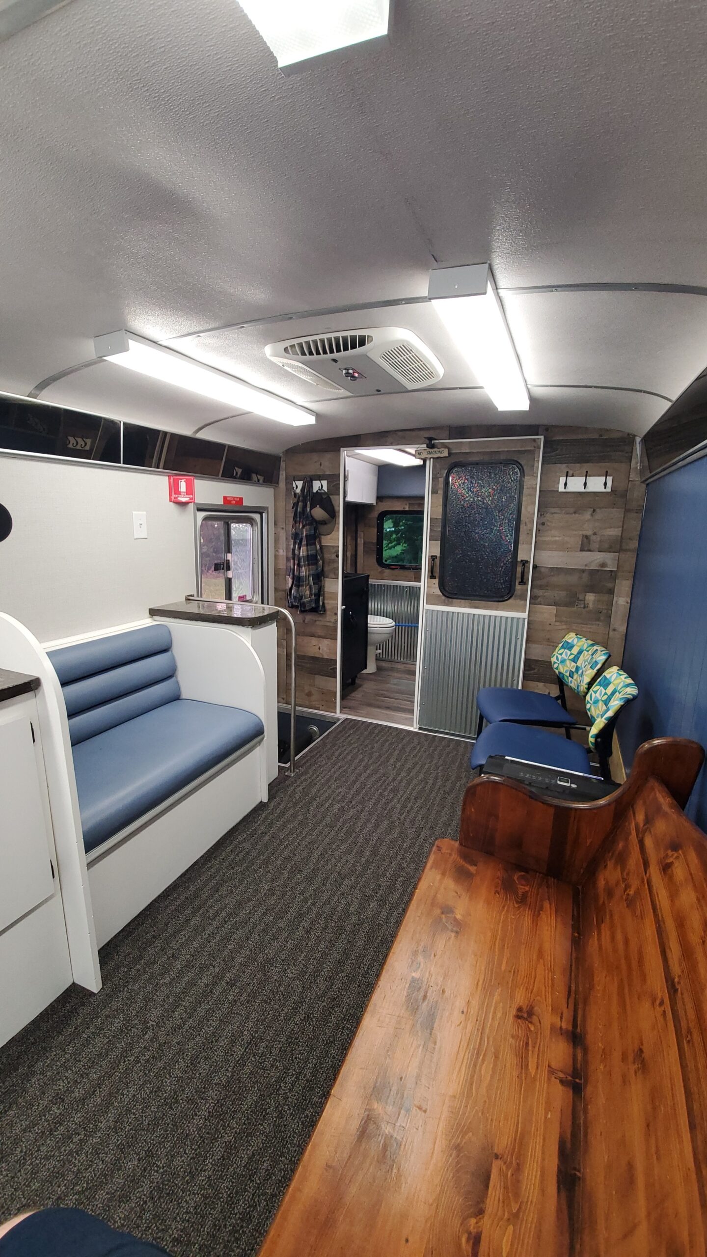 Mobile unit waiting area with seating and wood accents